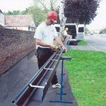 two men fixing seamless guttering